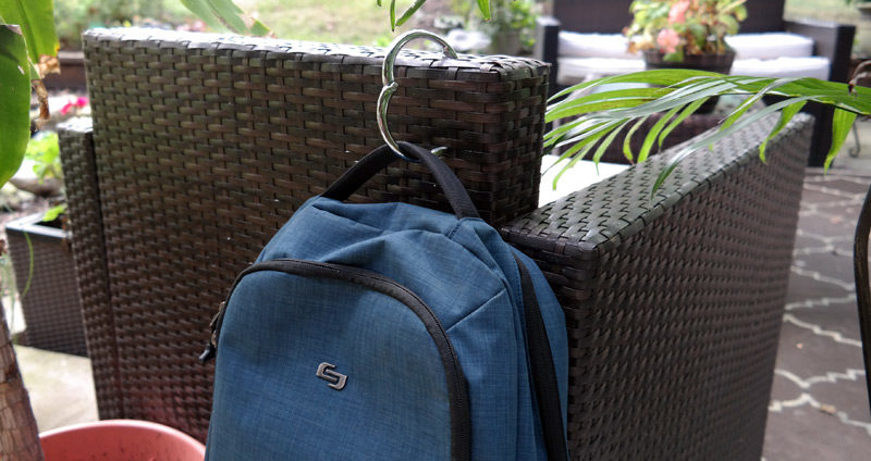 Protect your purse from dirty floors and thieves by hanging it right next  to you on the table according to ABC News and others