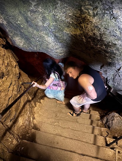 Visitors exploring Perry’s Cave at Put-in-Bay with limestone formations, underground lake, and guided tour.