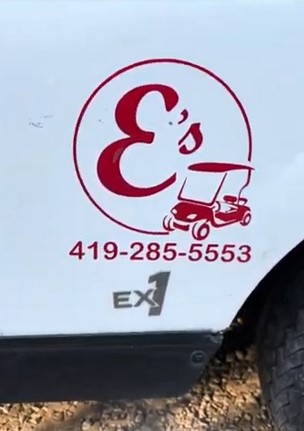 Family driving an E’s Golf Cart around Put-in-Bay attractions and lakefront views.