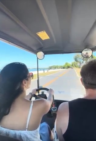 Family driving an E’s Golf Cart around Put-in-Bay attractions and lakefront views.