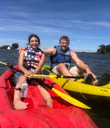 Kayakers paddling at Kayak the Bay in Put-in-Bay with Lake Erie in the background.