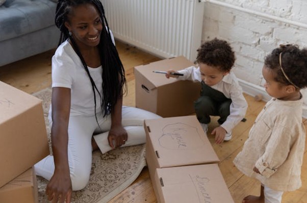 Mother and children with boxes