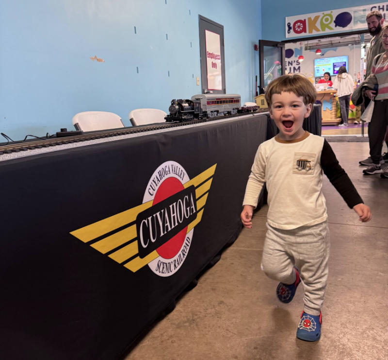 picture of boy running at Akron Children's Museum Akron Express Rails & Runways