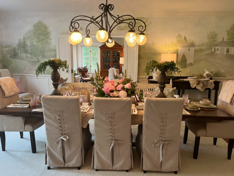 dining room table featured at Hudson Home and Garden Tour Home with floral display