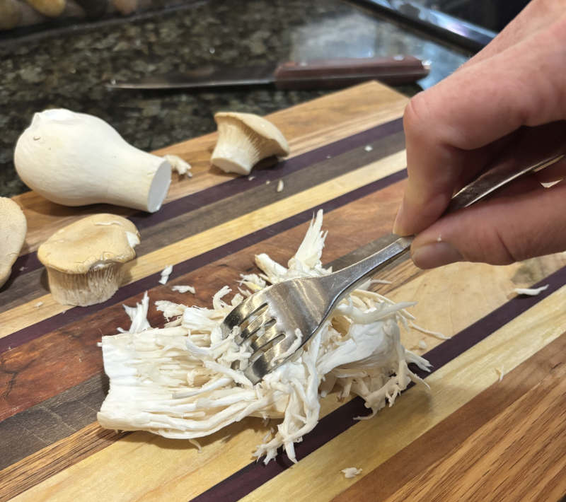 Shred Royal Trumpet mushrooms.