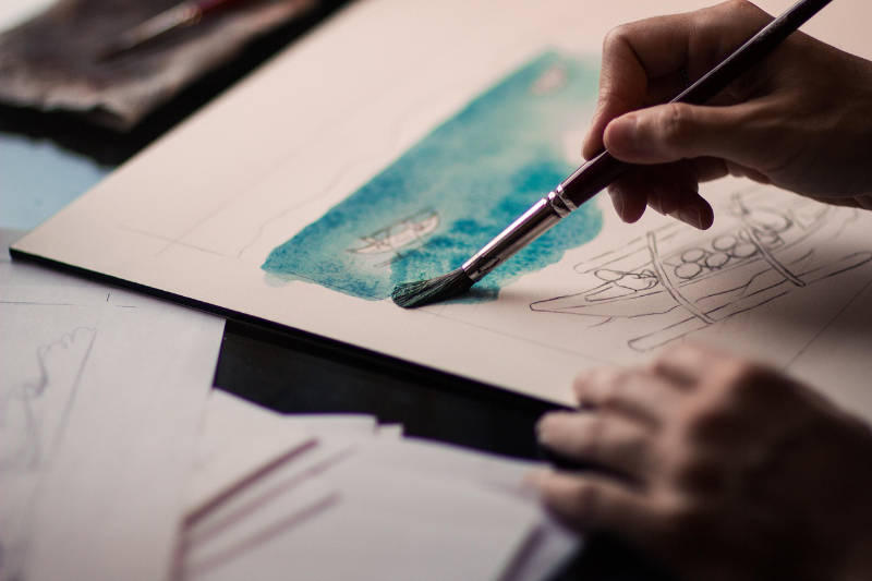 painting paintbrush in hand