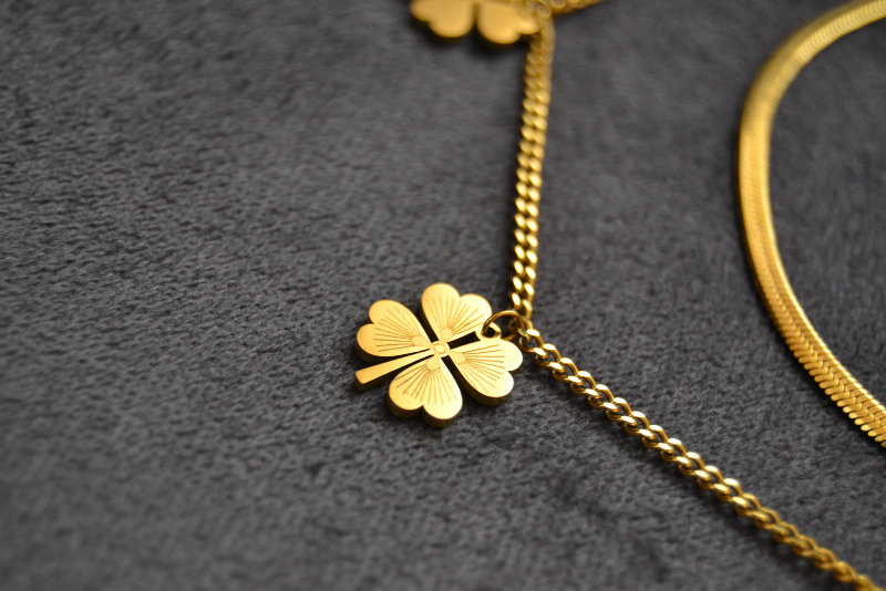 Gold Jewelry Charm with Four Leaf Clover