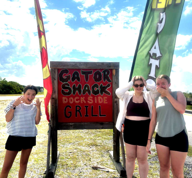 3 young women surprised that you can eat alligator in the Everglades - Miami, FL - Buffalo Tiger Airboat Tours Gator Shack