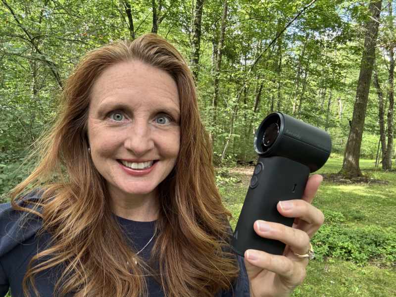 woman outside holding Aecooly Cold Air Portable Handheld Fan