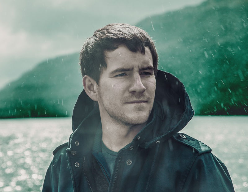 man in rain in coat