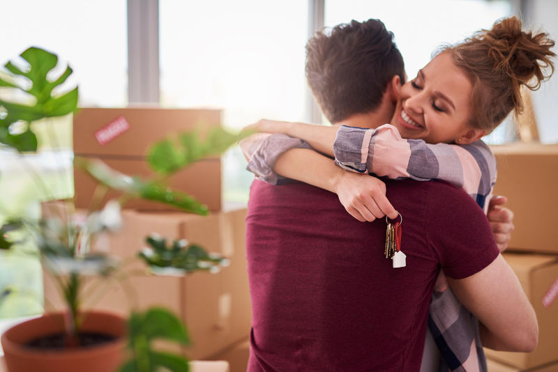 keys couple hugging home rent owner