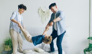 parents playing with child