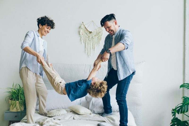 parents playing with child