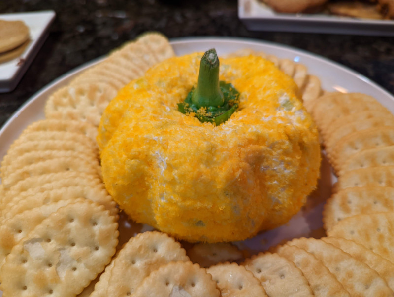 Pumpkin Shaped Cheese Ball with crackers on plate